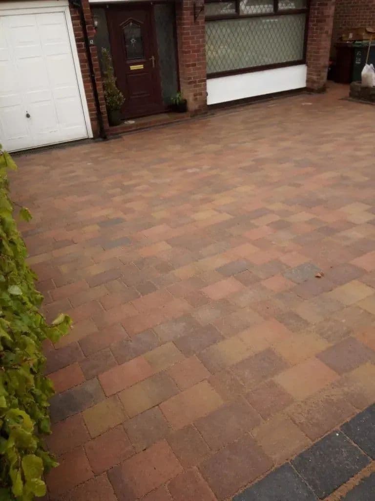 The new block-paved drive running up to the garage and the front door